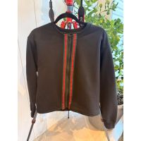 Closed front zipper and contrast striped trim on black jacket