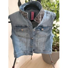Front view of size Medium light wash denim sleeveless vest with dark patterned stand collar