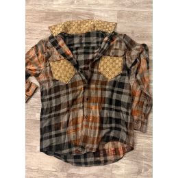 Rust charcoal and gray plaid flannel shirt with contrasting tan patterned chest pockets and collar