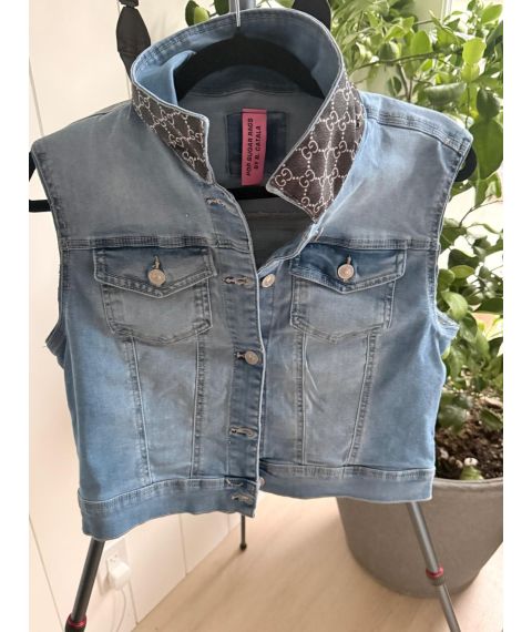 Front view of size Medium light wash denim sleeveless vest with dark patterned stand collar