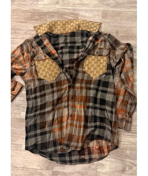 Rust charcoal and gray plaid flannel shirt with contrasting tan patterned chest pockets and collar