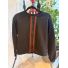 Closed front zipper and contrast striped trim on black jacket