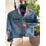 Front of medium blue denim jacket with contrast sand patterned collar and rolled cuffs